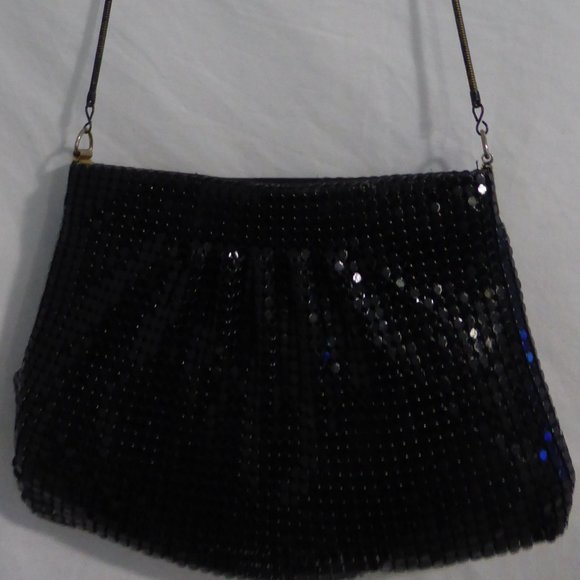 Black zip up purse with black shiny sequin